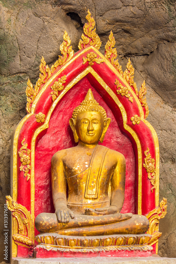 Fototapeta premium Buddha in the cave , deep to the cave in Thailand
