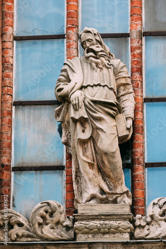 Riga Latvia. Close View Of Ancient Limestone Sculpture On Facade photo