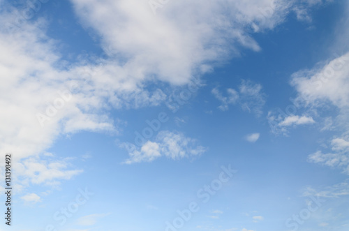 White fluffy clouds in blue sky and space