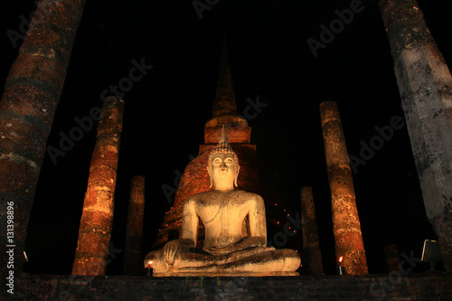 Bhudda sitting in temple at historic park, Sukothai, Thailand