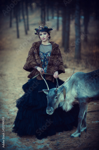 Girl and Deer in the forest
