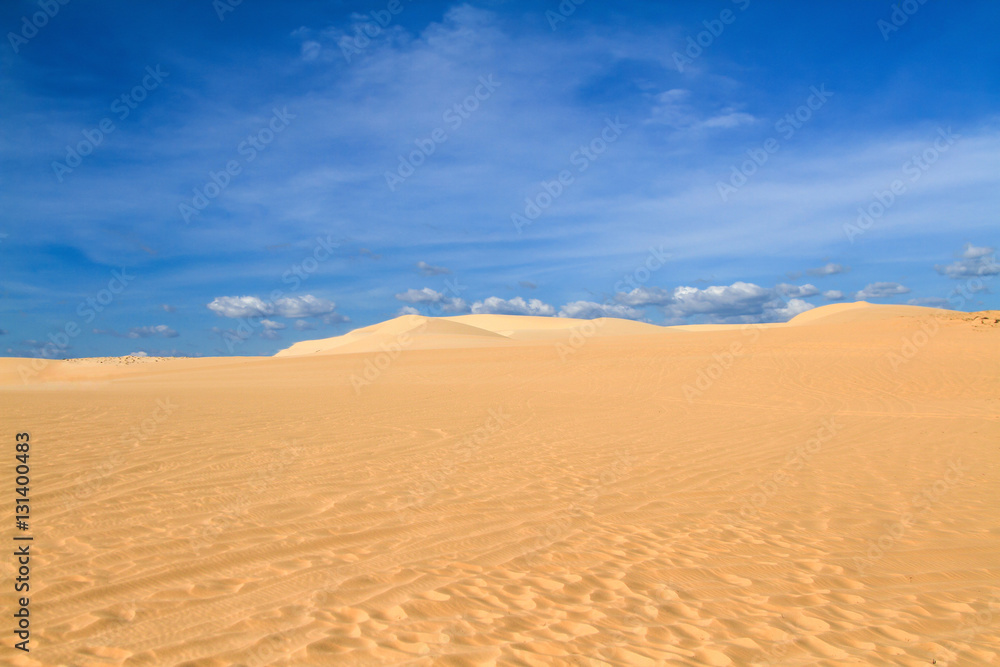Sand dune with footprints
