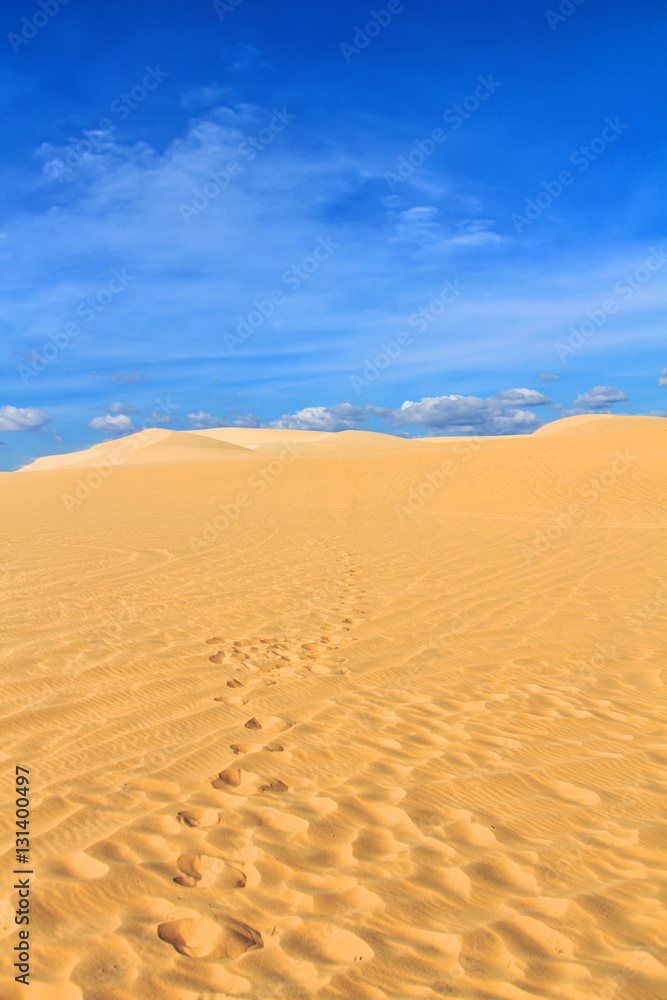 Sand dune with footprints