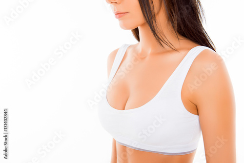 Close up portrait of shapely young woman in white bra