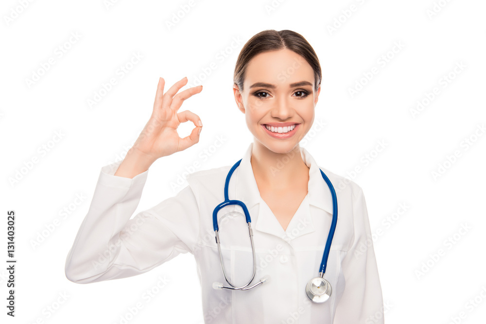 Portrait of happy doctor with beaming smile showing ok gesture Portrait of happy doctor with beaming smile showing ok gesture