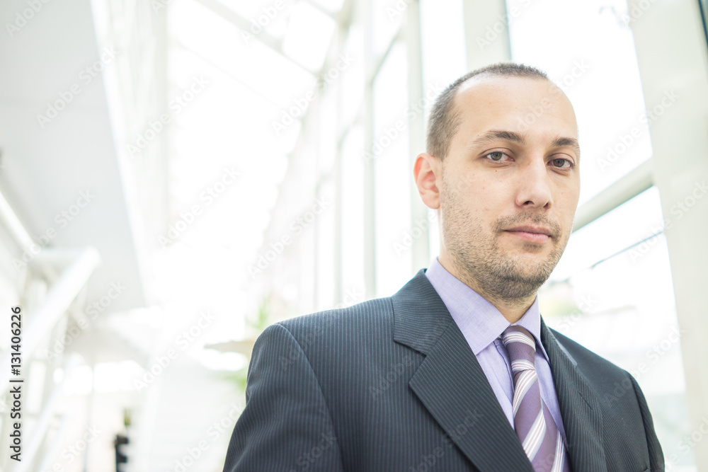 Successful businessman in office building Successful businessman in office building