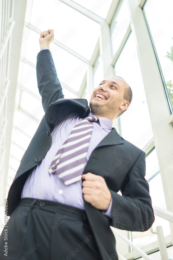 Young businessman in office building Young businessman in office building