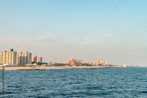 Roller coaster and buildings cityscape  on the Brighton Beach. It is known for its high population of Russian-speaking immigrants, and as a summer destination for New York City residents. © STUDIO MELANGE