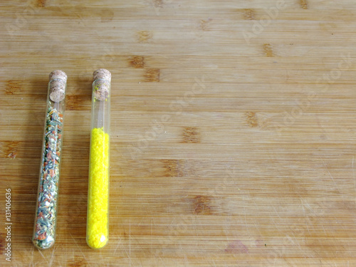 Spices in glass tubes on left Side photo