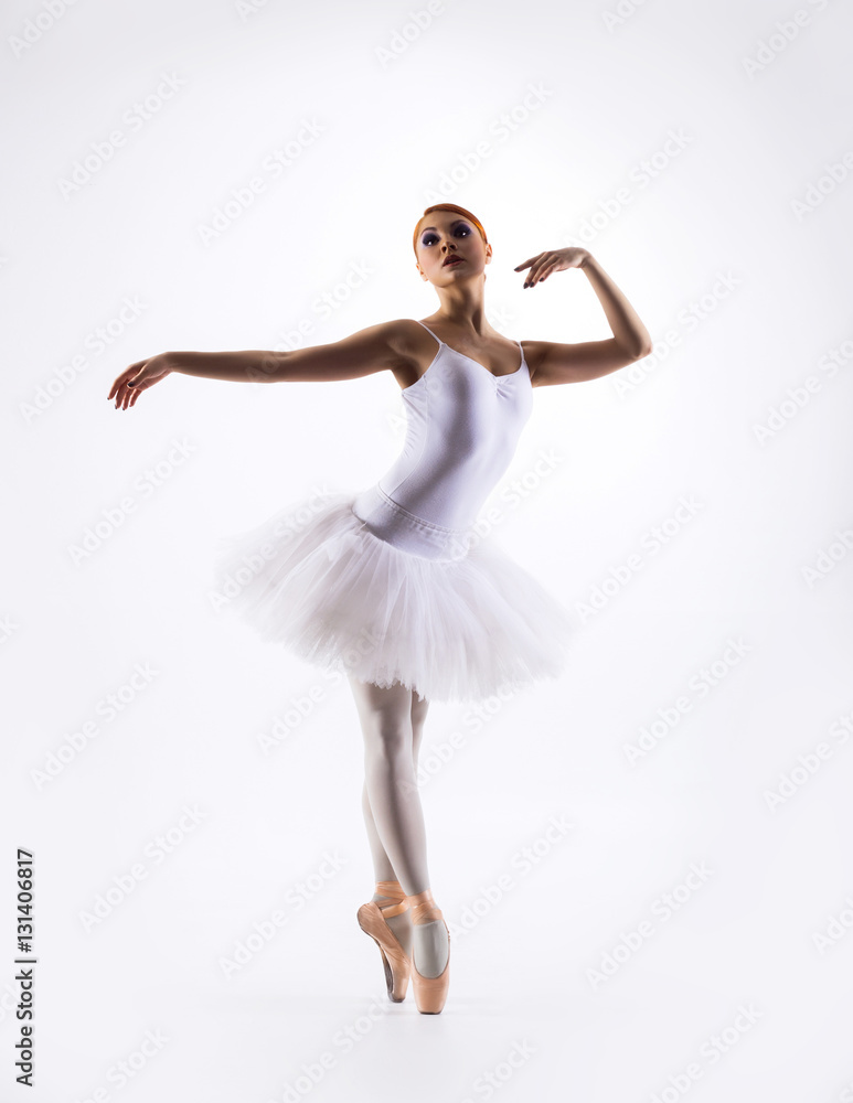 Young beautiful ballet dancer on a white background Young beautiful ballet dancer on a white background