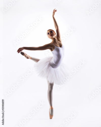Fototapeta Naklejka Na Ścianę i Meble -  Young beautiful ballet dancer on a white background