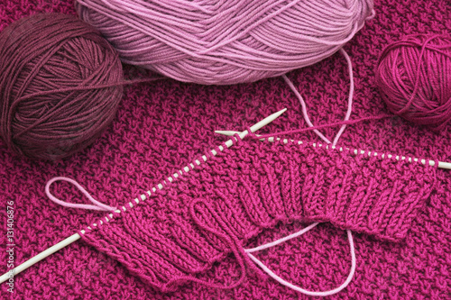 Balls of yarn and knitting  needles