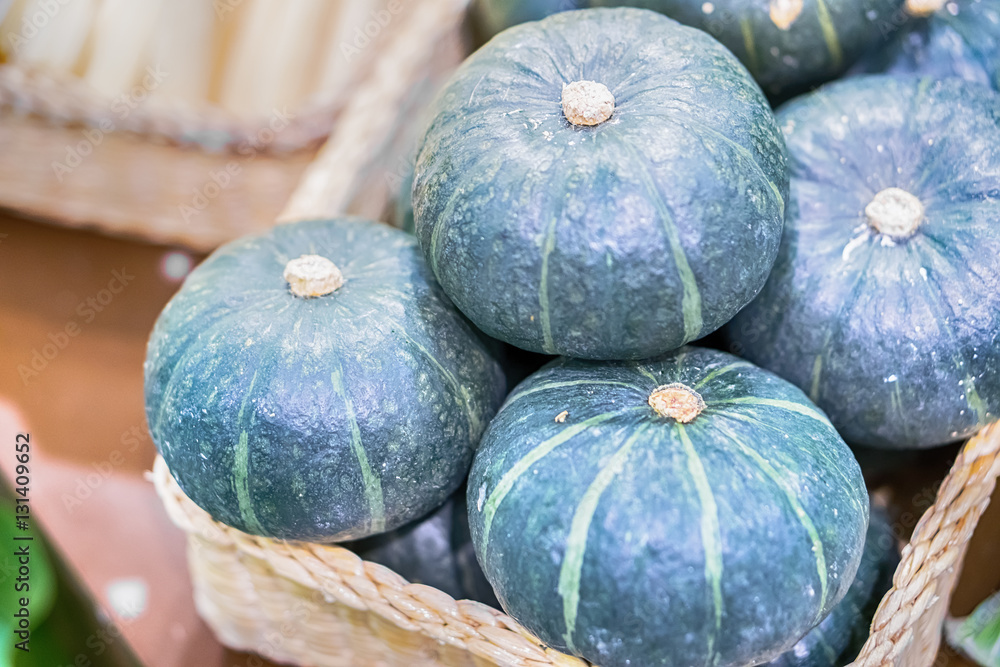 piles of green pumpkin in farm during harvest season piles of green pumpkin in farm during harvest season