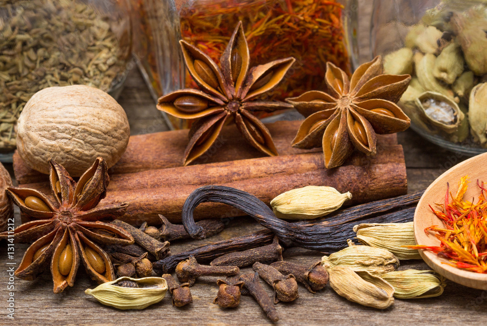 Spices for desserts on the wooden table Spices for desserts on the wooden table
