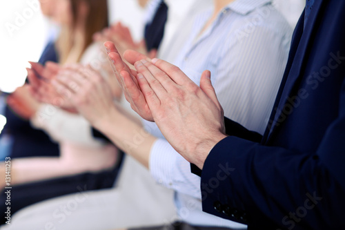 Close up of business people hands  clapping at conference © rogerphoto