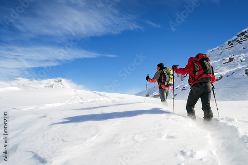 ski mountaineering in snowstorm photo