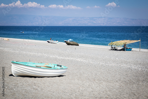 Canvas Print Beached rowboat in Sicily