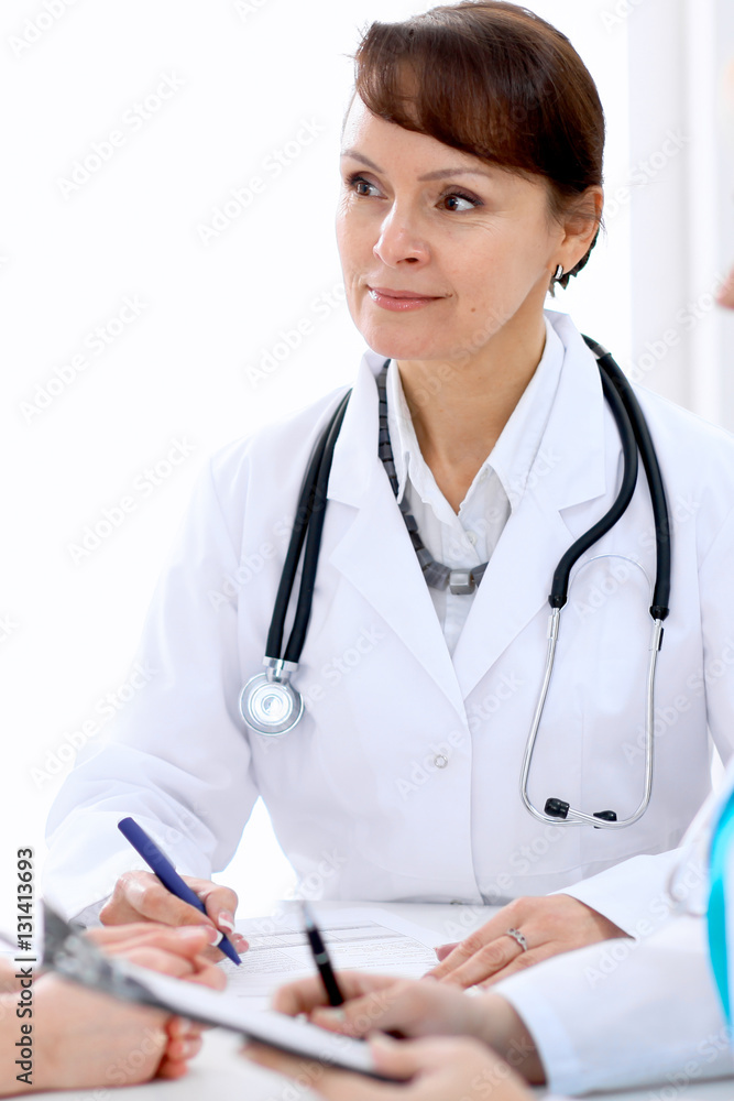 Doctor and patient at meeting. Medicine and health care concept. Doctor and patient at meeting. Medicine and health care concept.