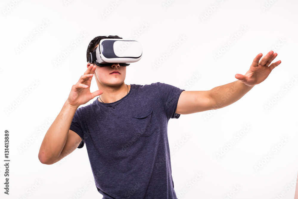 Man wearing virtual reality using a VR headset on white background Man wearing virtual reality using a VR headset on white background