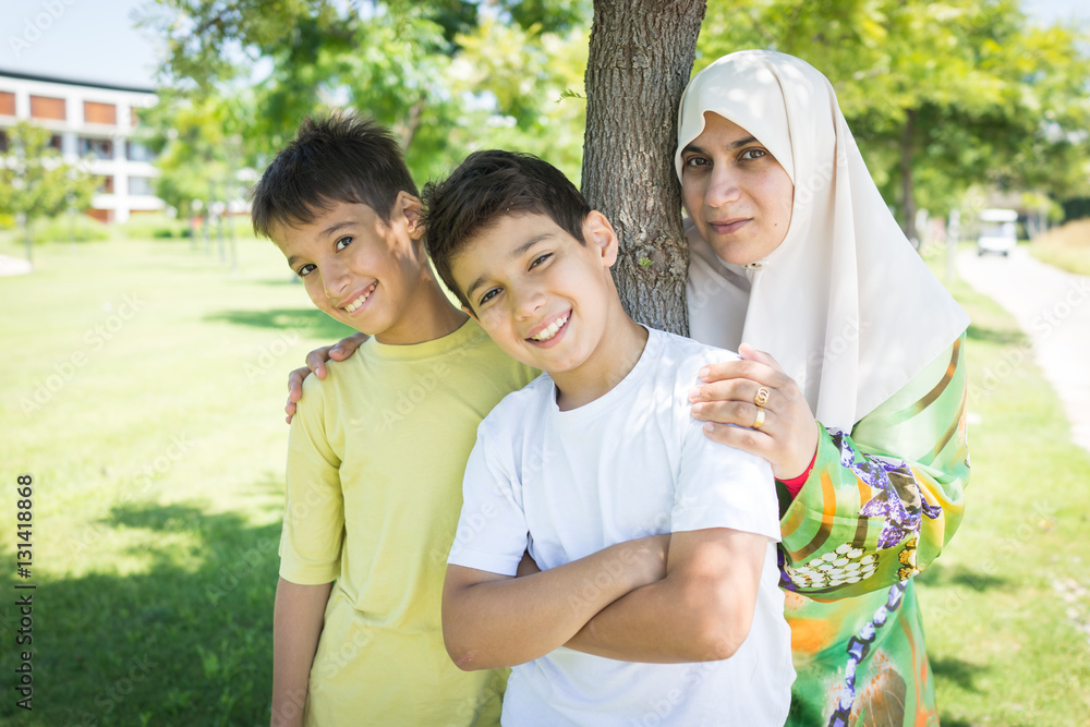 Muslim Arabic mother and kid in nature Muslim Arabic mother and kid in nature