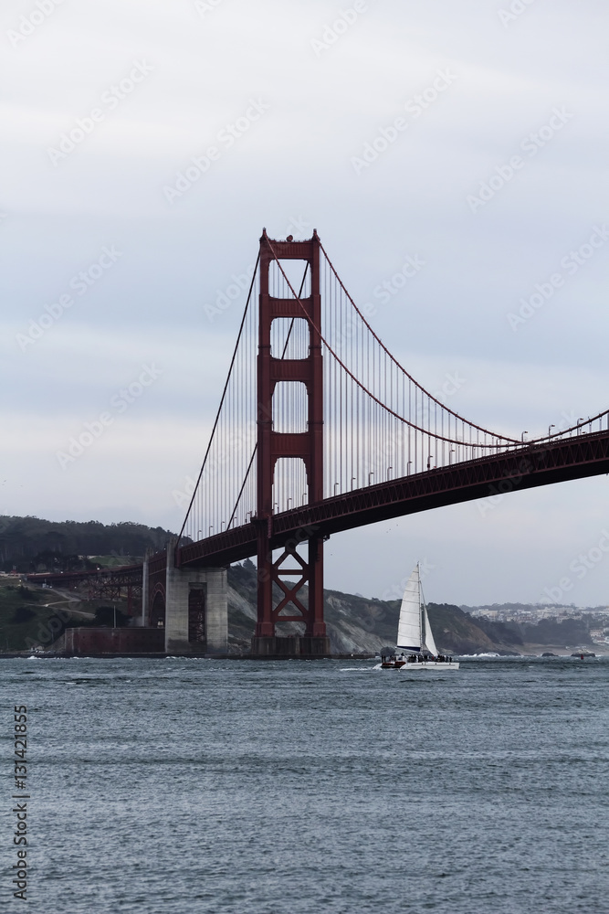 Sailing Catamaran Underneath The Golden Gate Bridge Sailing Catamaran Underneath The Golden Gate Bridge