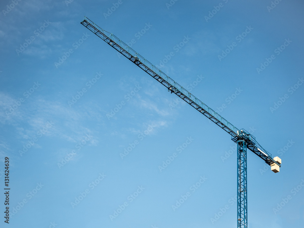 Construction crane isolated under blue sky