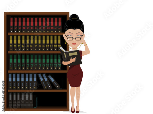 Businesswoman is seriously auditing document file  in front of the file shelf.

