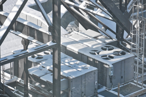 Snow on rooftop machinery