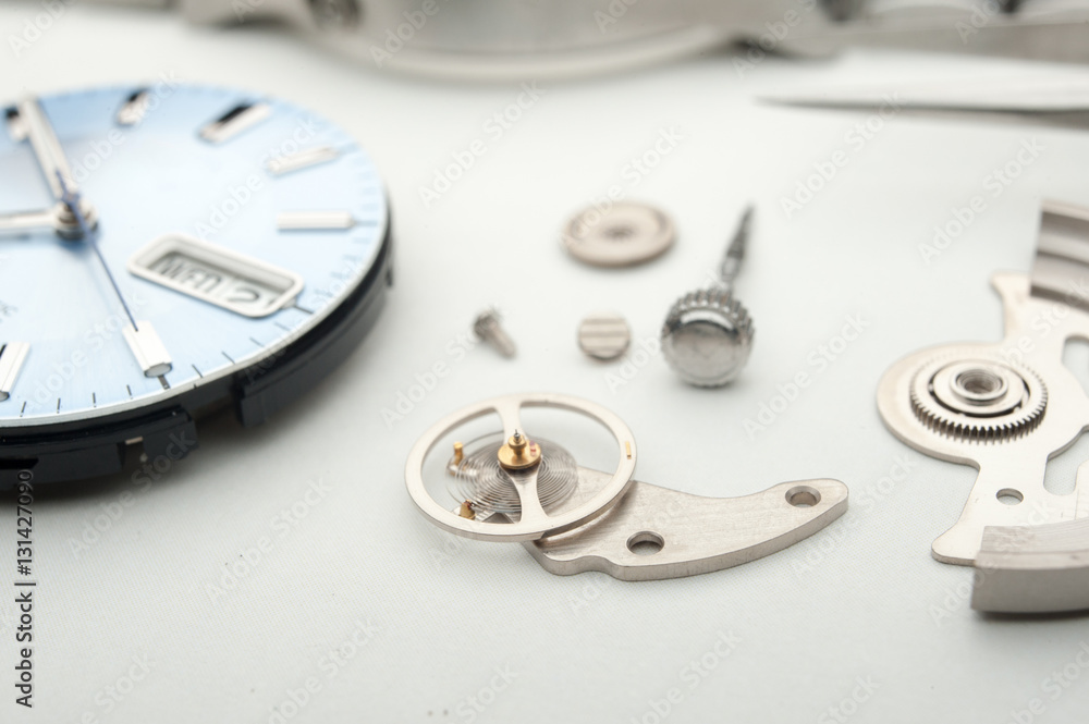 Detail of watch machinery on the table. Detail of watch machinery on the table.