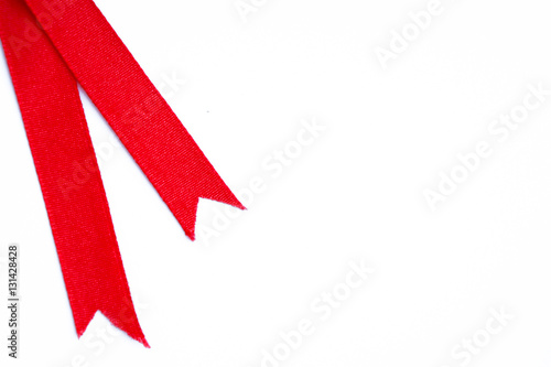 Red ribbon on white background, white paper for greeting card photo
