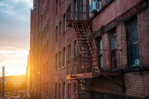 Canvas Print Fire Escape stairs on the building wall in New York City