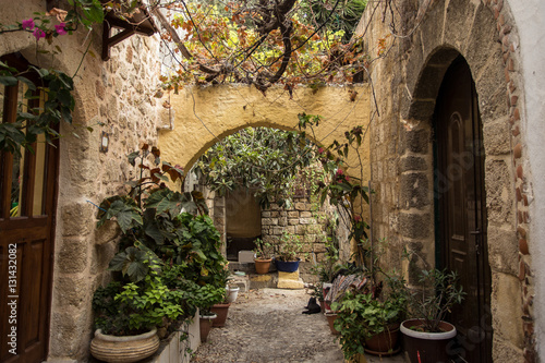 Medieval arched backstreet in the old town of Rhodes, Greece