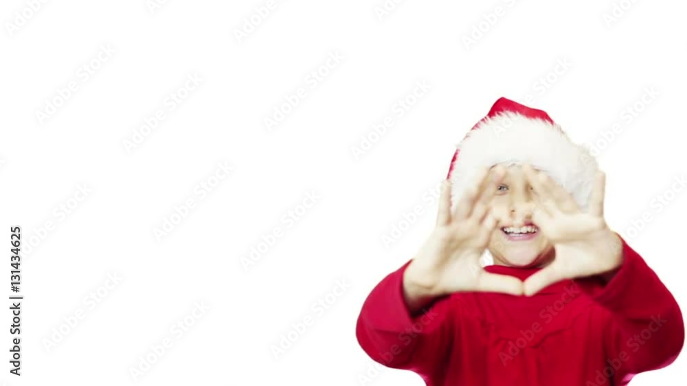 girl in the hat of Santa Claus showing gesture heart on a white background girl in the hat of Santa Claus showing gesture heart on a white background