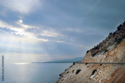 Солнечные лучи сквозь облака над Эгейским морем