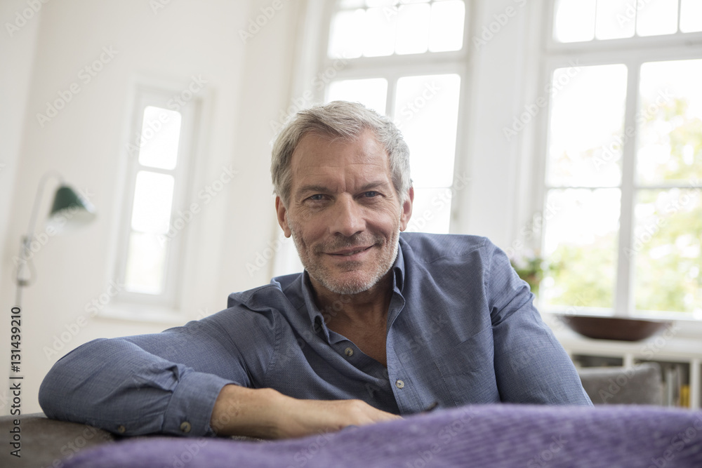Portrait of mature man at home on the sofa Portrait of mature man at home on the sofa