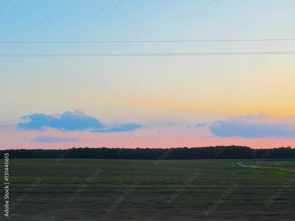 Beautiful landscape under evening sky with clouds Beautiful landscape under evening sky with clouds