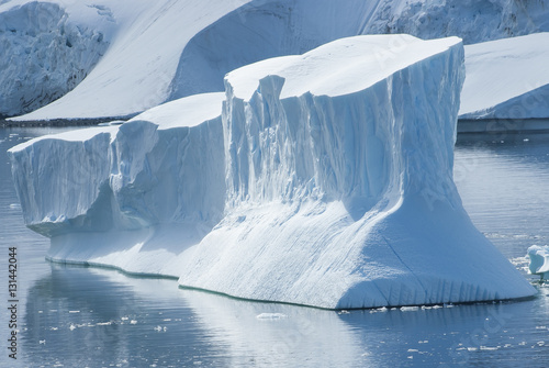 large iceberg in the Strait between the islands off the west coa photo