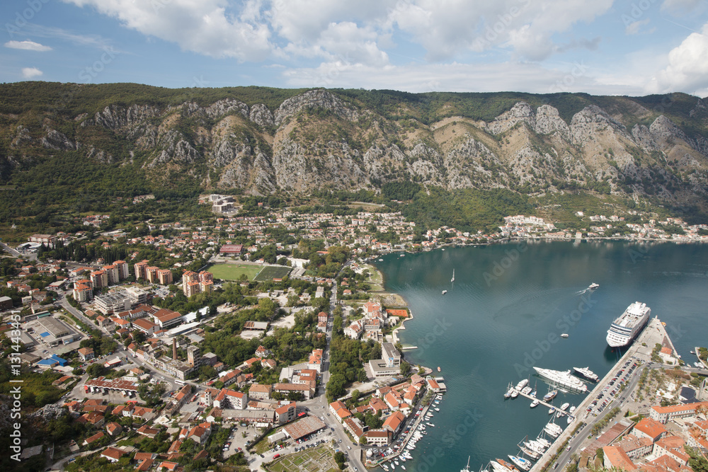 Magnificent views from the top of the city, mountains and the ships in the port of Kotor Bay.