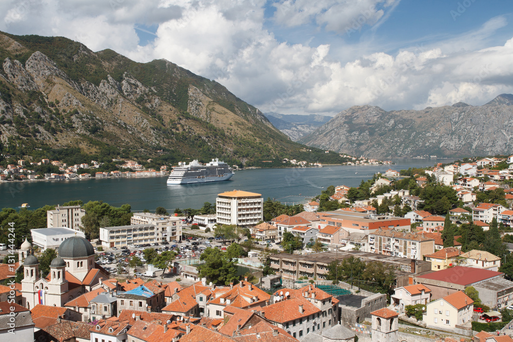 beautiful view of the old town and white cruise ship in the Bay of Kotor. Montenegro