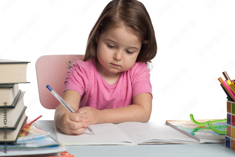Small girl learning how to write Small girl learning how to write