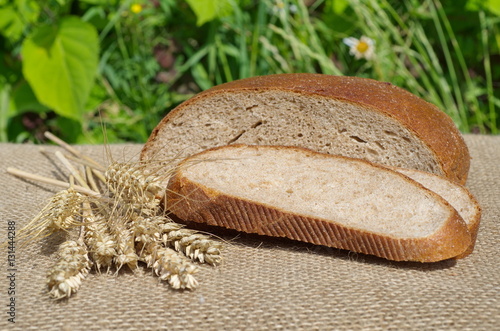 Ears of rye and rye bread on burlap