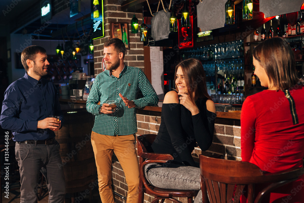 two of the men in the bar he meets  women