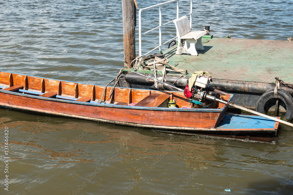 Small fast wooden boat on a river Small fast wooden boat on a river