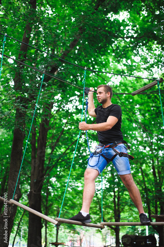 Hiking in the rope park beautiful sports guy