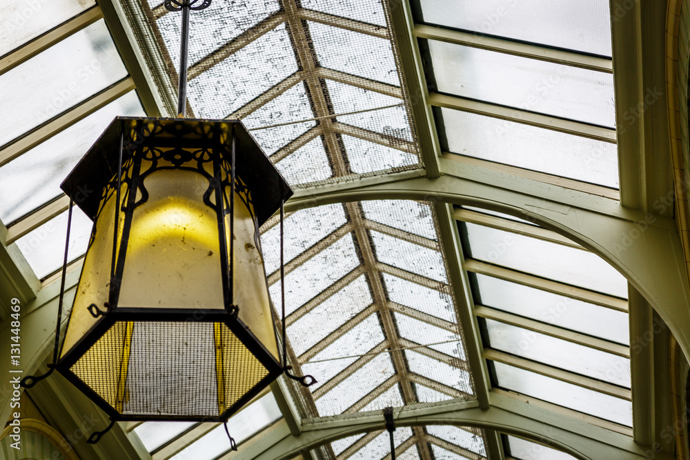 A large lamp in a corridor of an old style shopping mall A large lamp in a corridor of an old style shopping mall