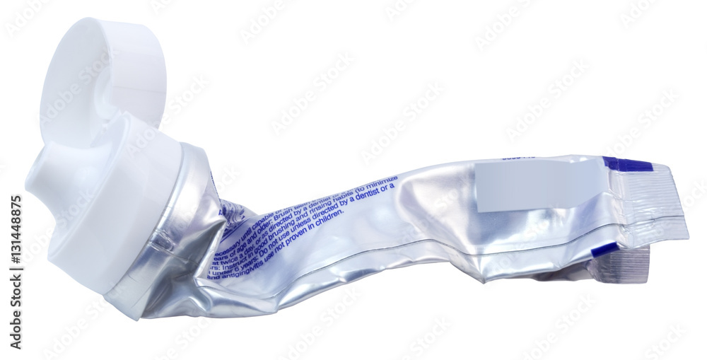 Roughly squeezed tube of toothpaste. Cap open. Isolated. Horizontal