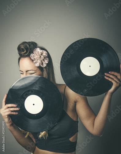 Fashionable woman with two vinyl LP records
