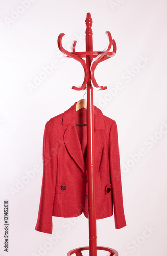 Red jacket hanging on a coat stand