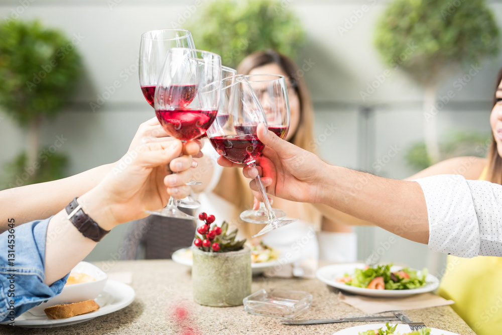 Closeup of some friends drinking wine Closeup of some friends drinking wine