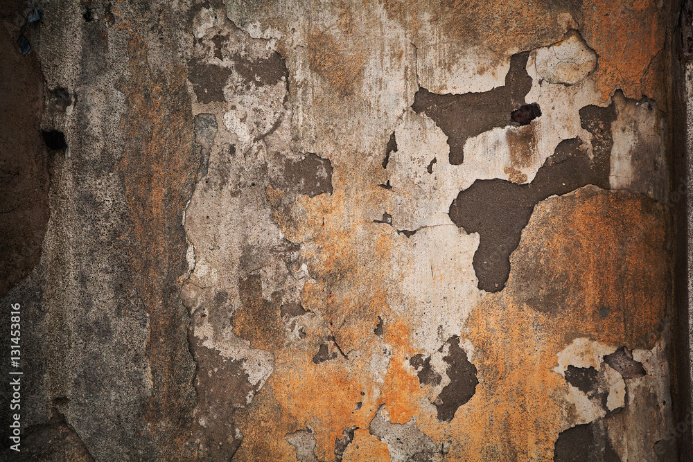 Texture a dark dingy stone surface. Shabby grungy background. Peels the old paint off the wall. Rough concrete texture.